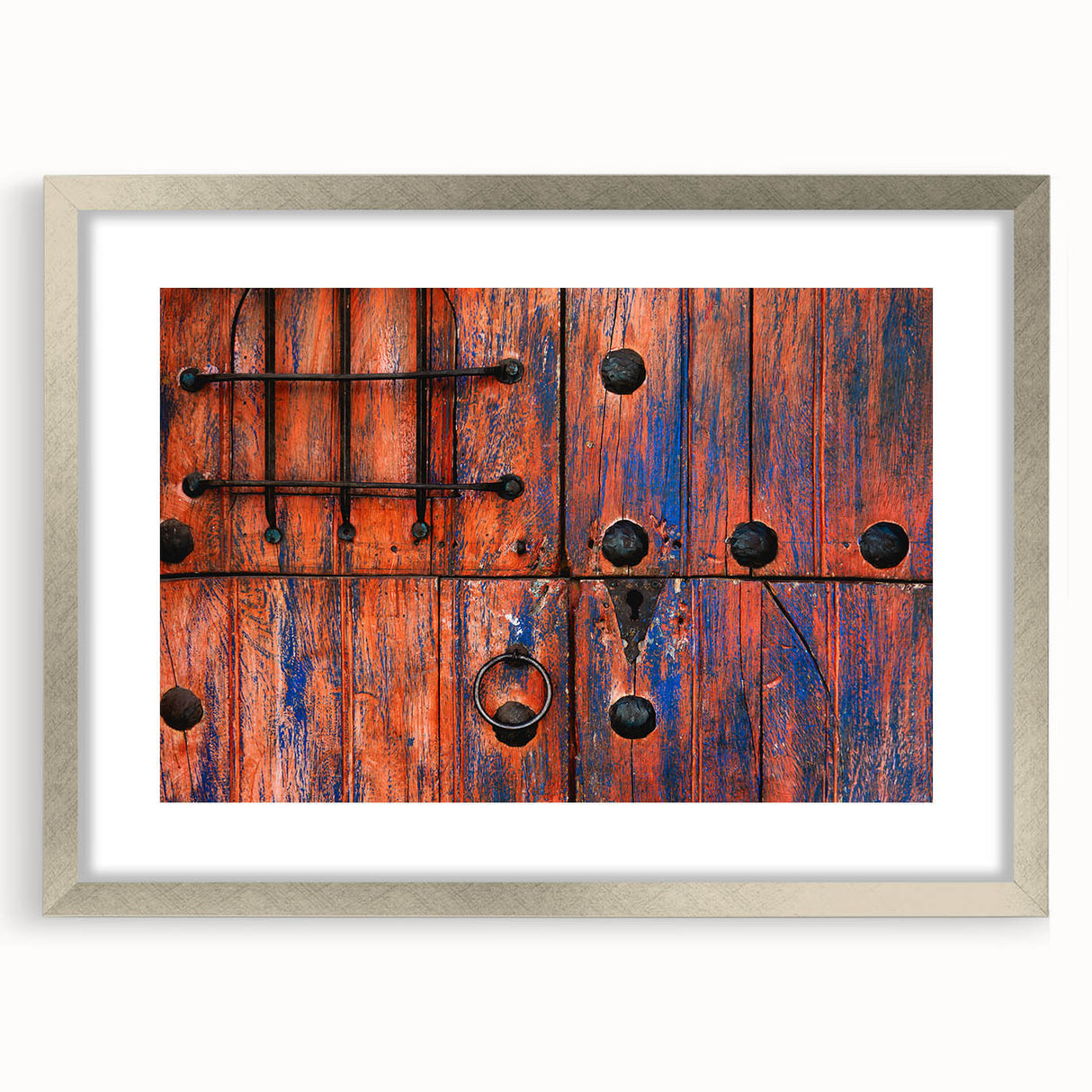 Textured abstract art print of Baja California scenery in muted earth tones, framed in silver, ideal for bedroom ambiance.