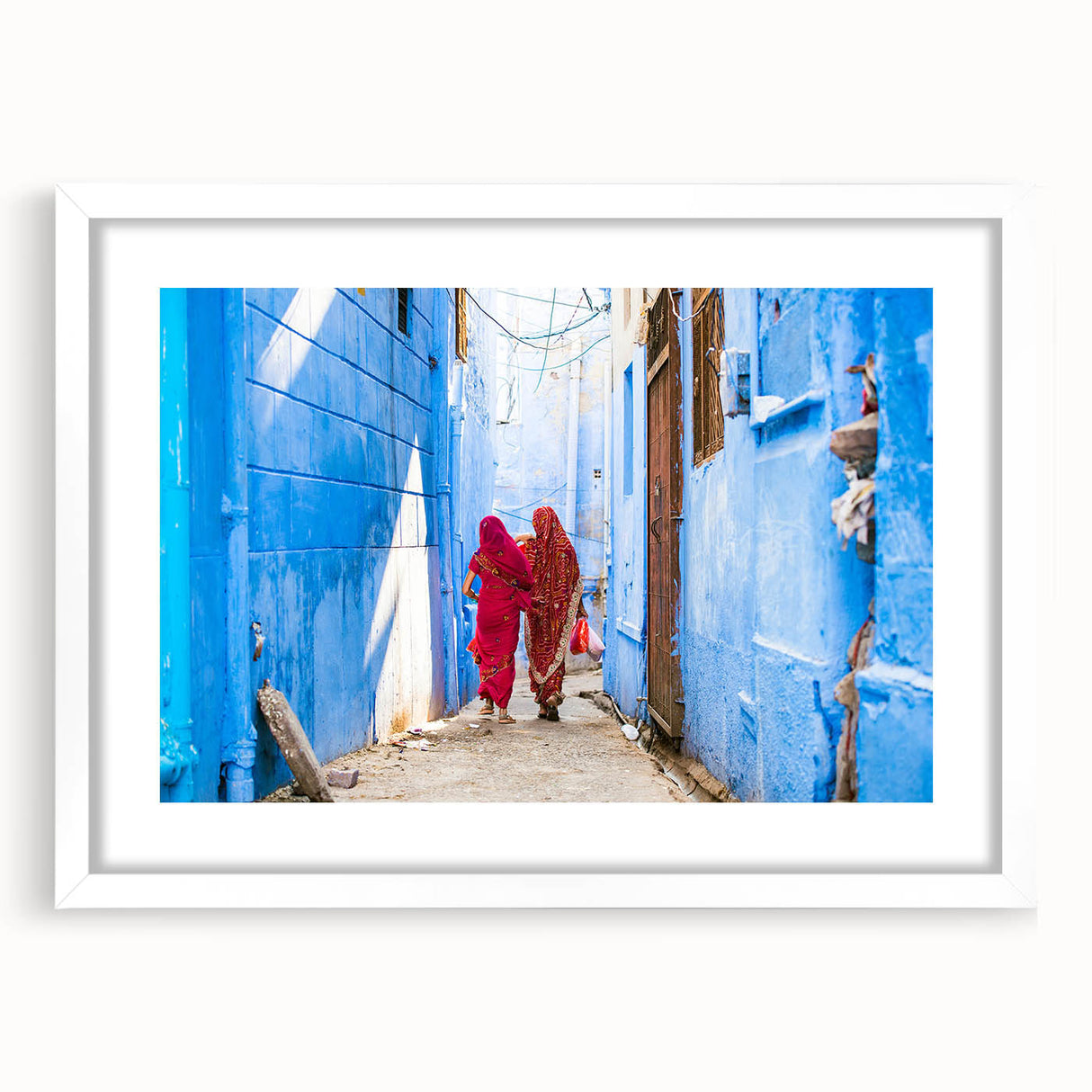 Abstract art print of an Indian landscape in muted earth tones on a framed white canvas, suitable for dining room decor.