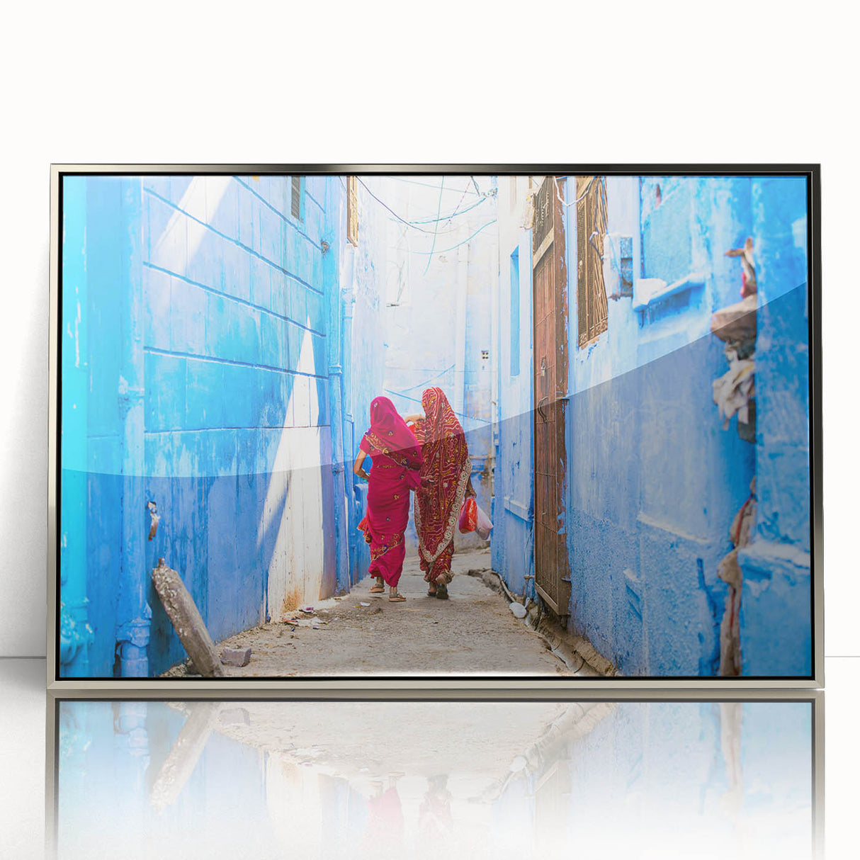 Mid-century modernist art depicting a serene Indian landscape in muted earth tones on a silver-framed acrylic print.