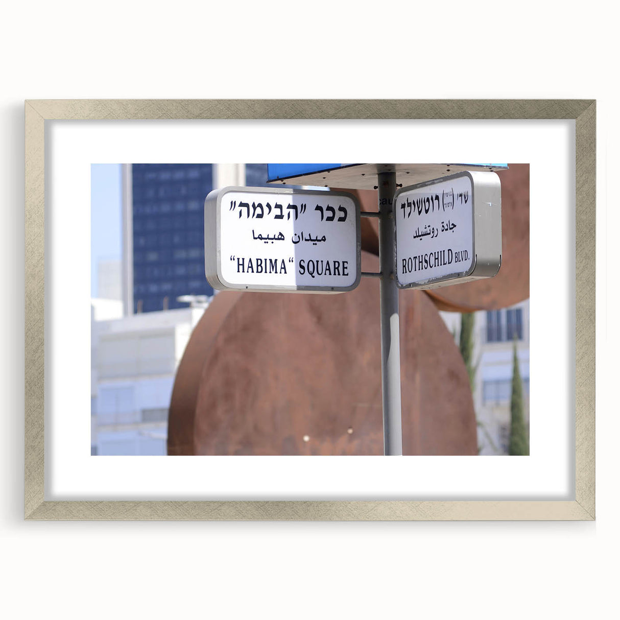 Textured art print of abstract Tel Aviv skyline in muted earth tones on a framed silver mat, suitable for bedroom decor.