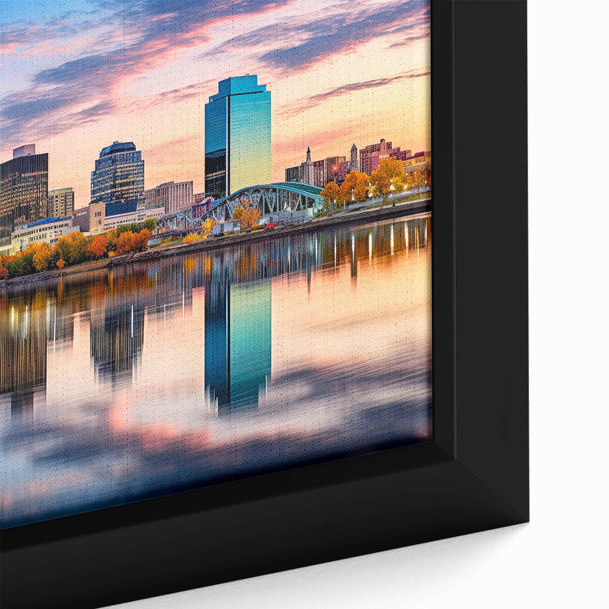 Close-up of textured black wall art depicting Arkansas scenery on framed canvas, featuring colorful accents.