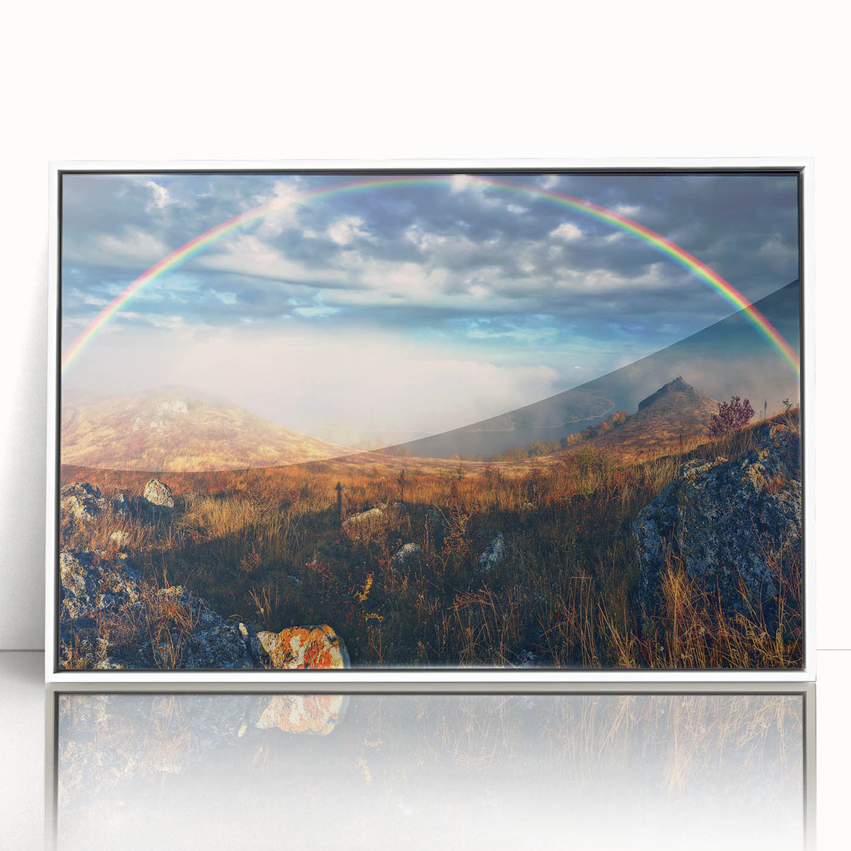 Acrylic print of a European landscape in muted green and blue tones, framed in white.