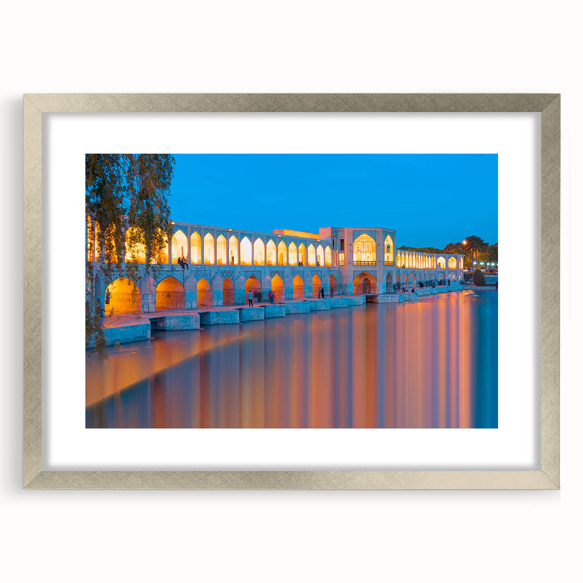 Textured abstract art print depicting a Middle Eastern landscape in earth tones, framed in silver, suitable for bedroom art.