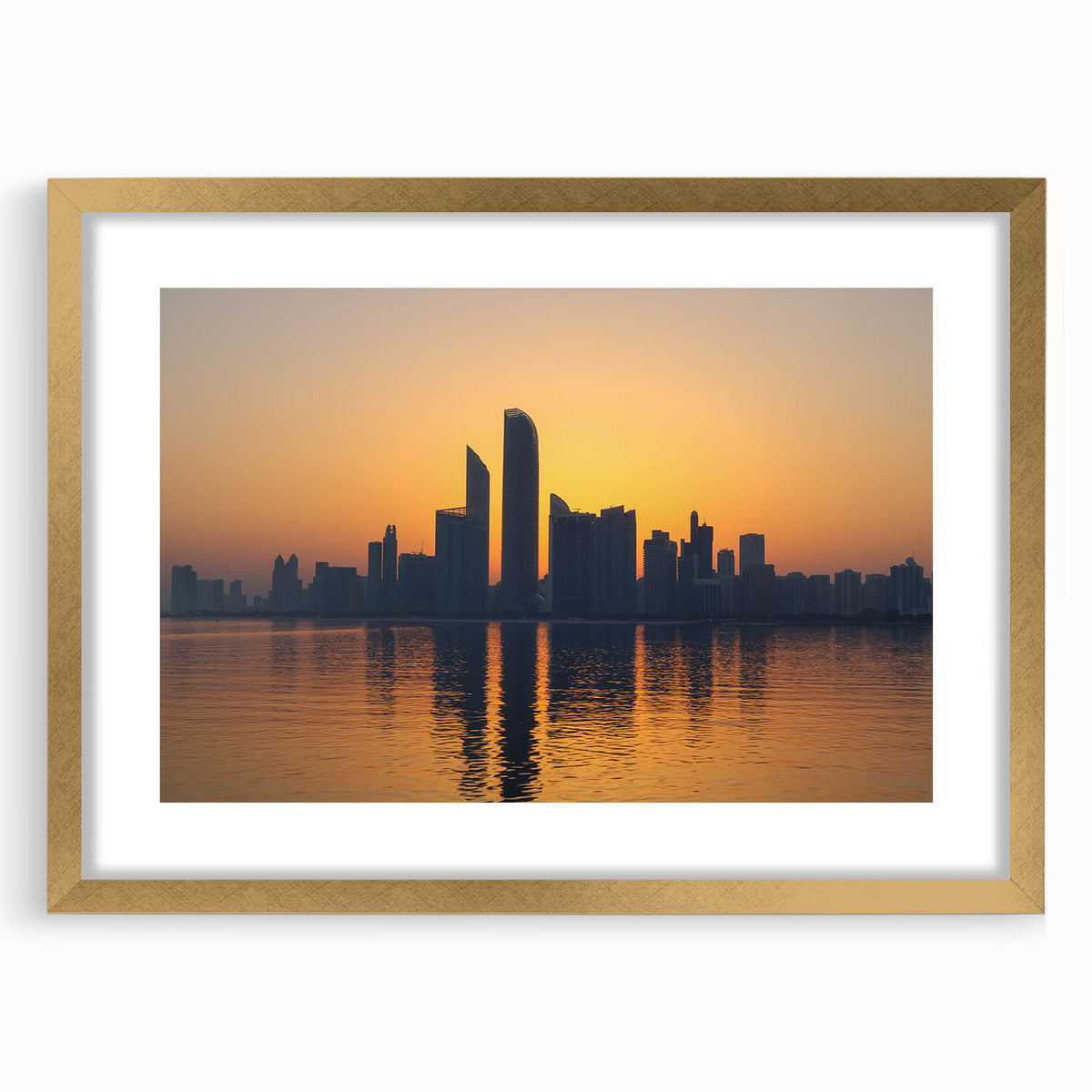 Extra large abstract art print of Abu Dhabi scenery in muted earth tones on a textured canvas, framed in gold.