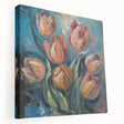 Stretched canvas artwork showcasing vibrant abstract floral designs in shades of pink, green, and blue, displayed from a side view, ideal for modern home decor.