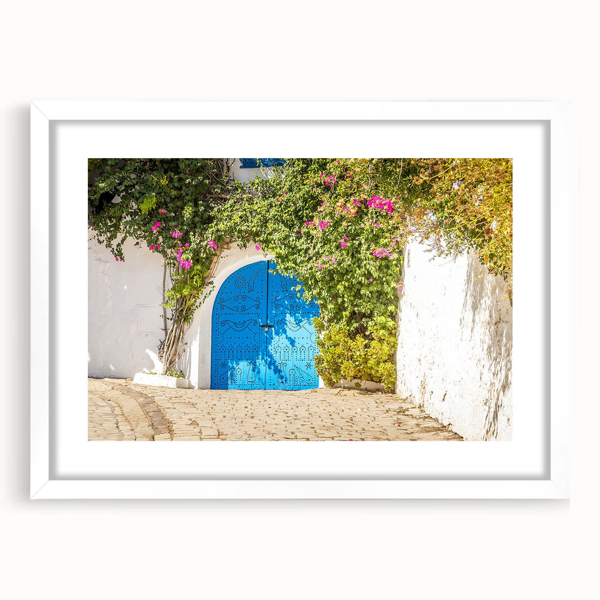 Abstract art print of Tunisia scenery in muted earth tones on a white matted frame, suitable for dining room decor.
