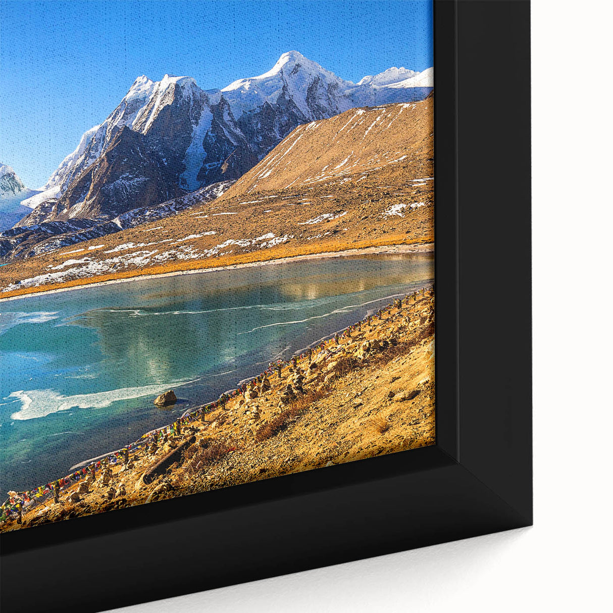 Close-up of black wall art featuring a textured, colorful Indian scenery on a framed canvas, ideal for living room decor.