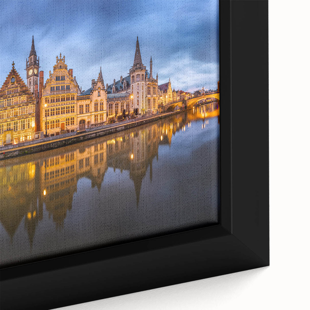 Close-up of a black framed canvas featuring a textured, colorful European scenery, ideal for living room decor.
