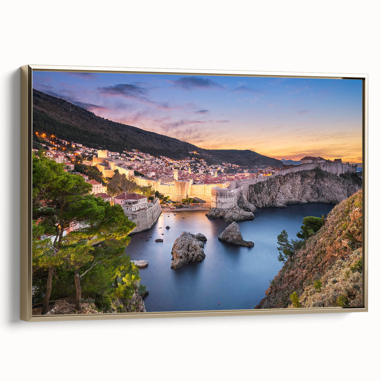 Framed canvas depicting a vintage-style landscape of a Croatian coastline in muted gold and black tones.