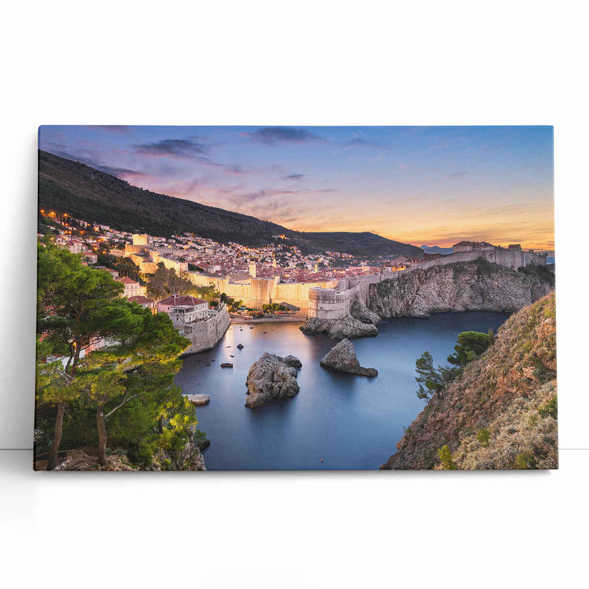 Black and white photograph of a European coastal town on a stretched canvas.