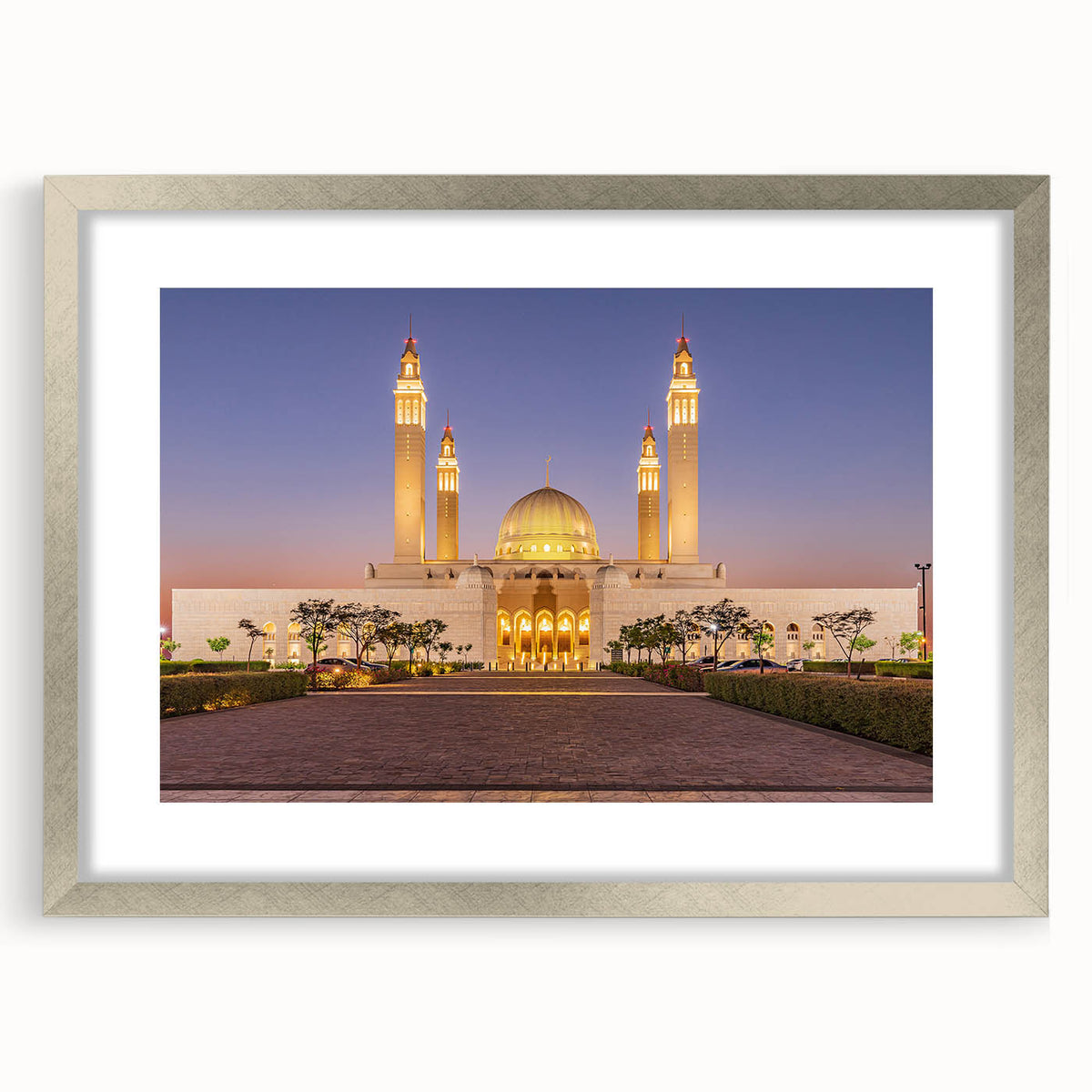 Textured art depicting abstract scenery of Oman in muted earth tones on a framed silver mat, ideal for bedroom art.
