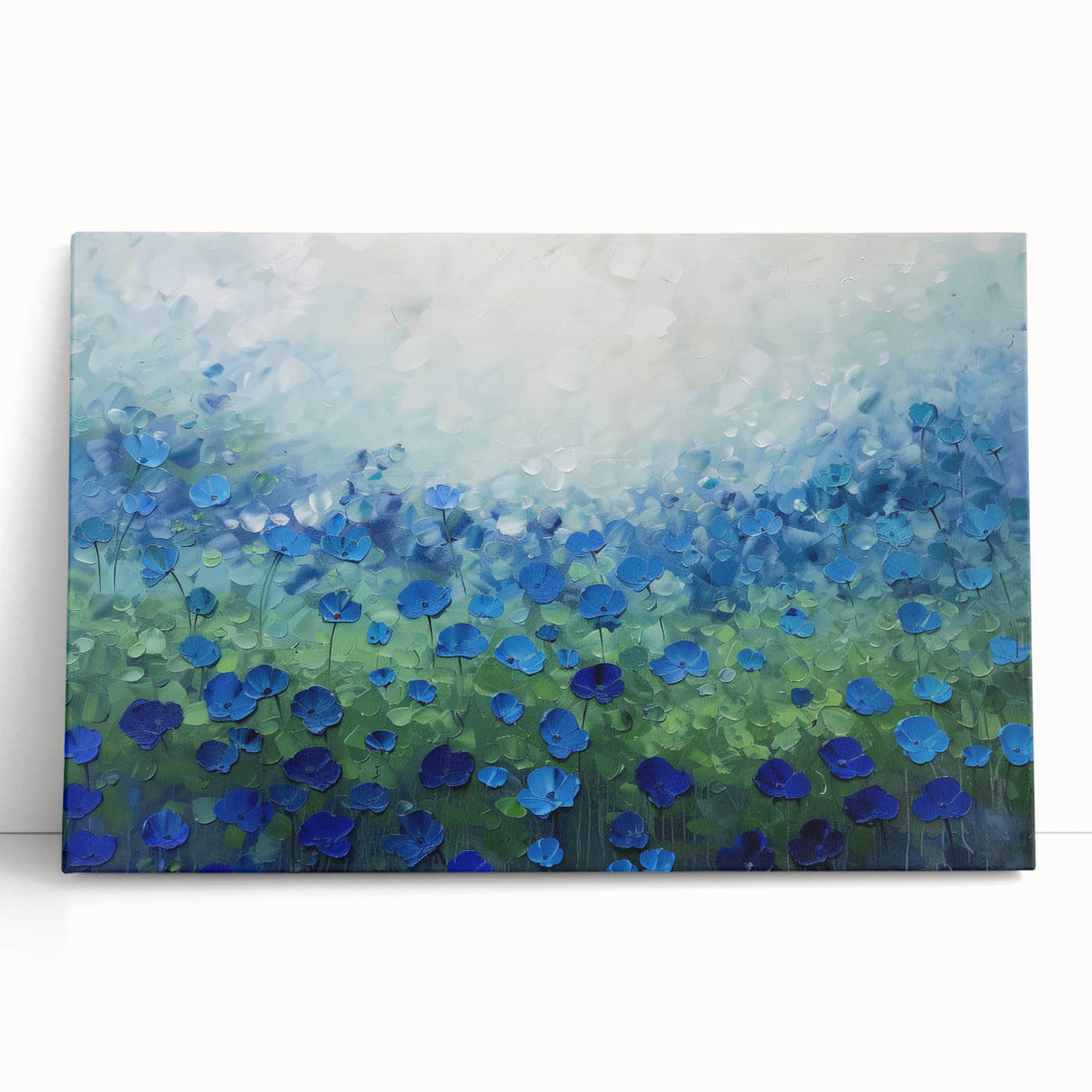 Abstract floral canvas art featuring vibrant colors like pink, blue, and green, elegantly leaning against a neutral wall, enhancing modern home decor aesthetics.