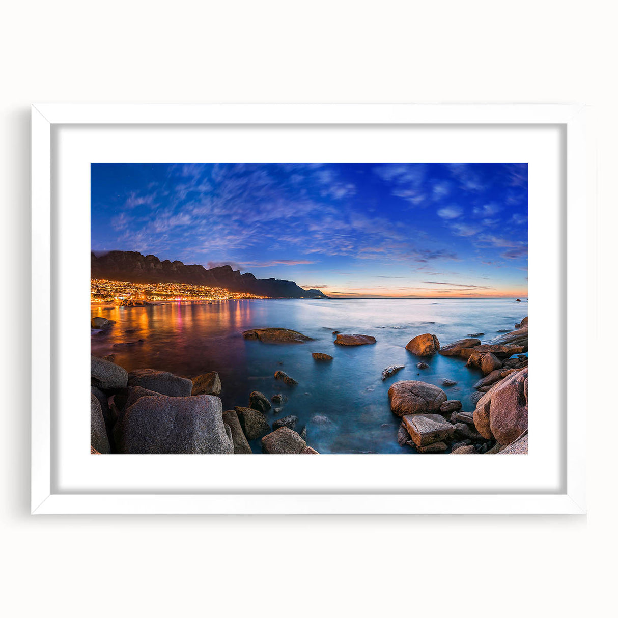 Abstract art print of an African landscape in muted earth tones on a framed white canvas, suitable for dining room decor.