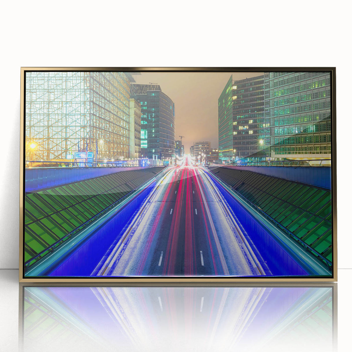 Art deco poster of a European cityscape in gold and black tones on framed acrylic.