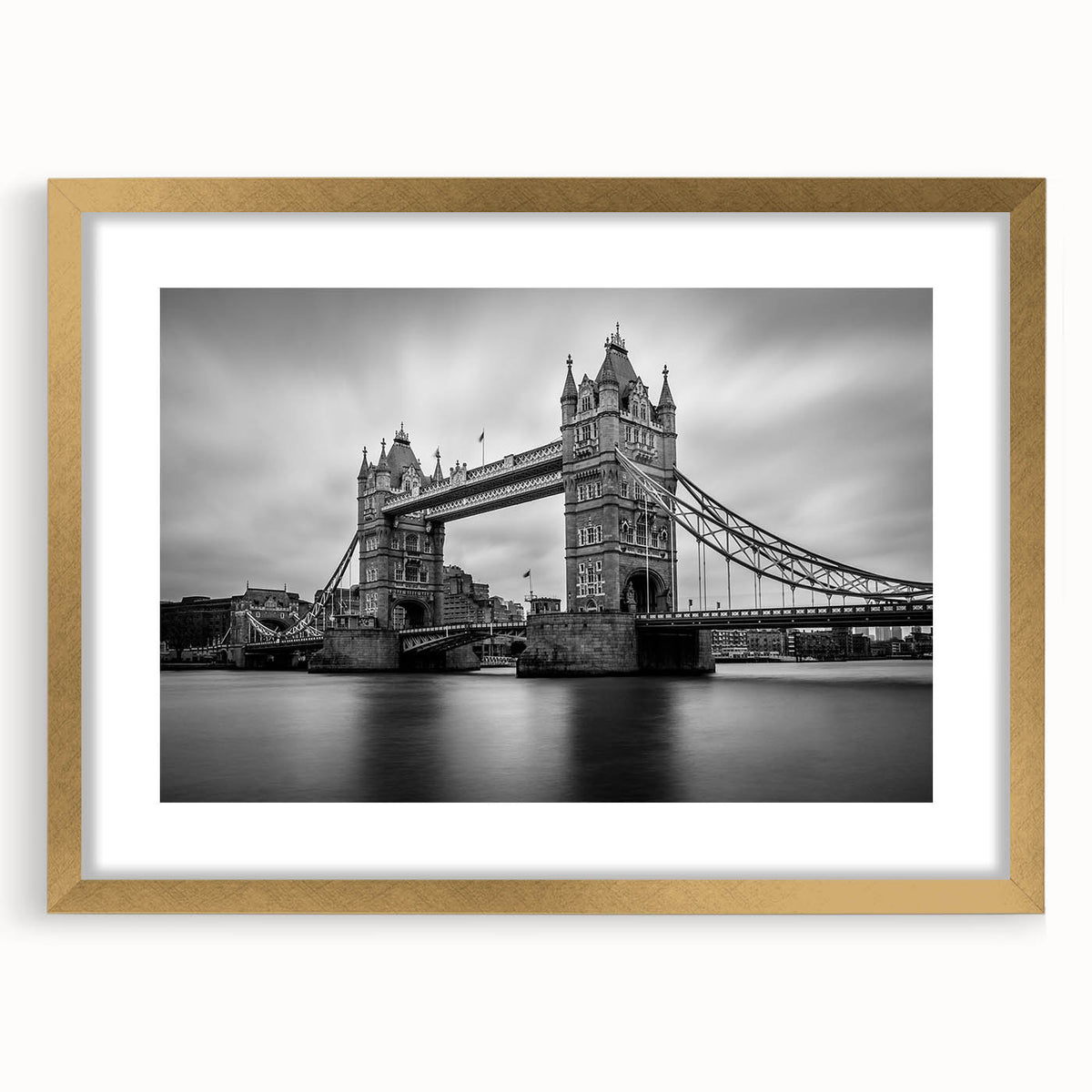 Abstract art print of London skyline in muted gold and black tones on a framed canvas.