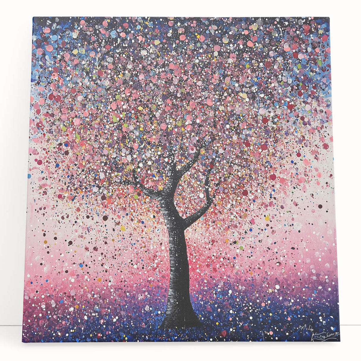 Abstract floral canvas art in vibrant colors, featuring a modern design with soft lines and shapes, leaning against a neutral wall, ideal for home decor.