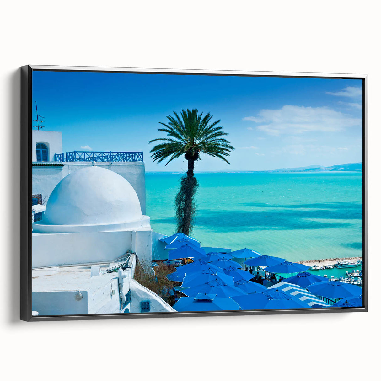 Black and white framed canvas of a Tunisian landscape in vintage poster style, ideal for bedroom decor.