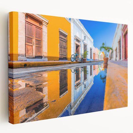 Side view of a stretched canvas featuring a scenic Yucatan landscape in vibrant green and blue tones.