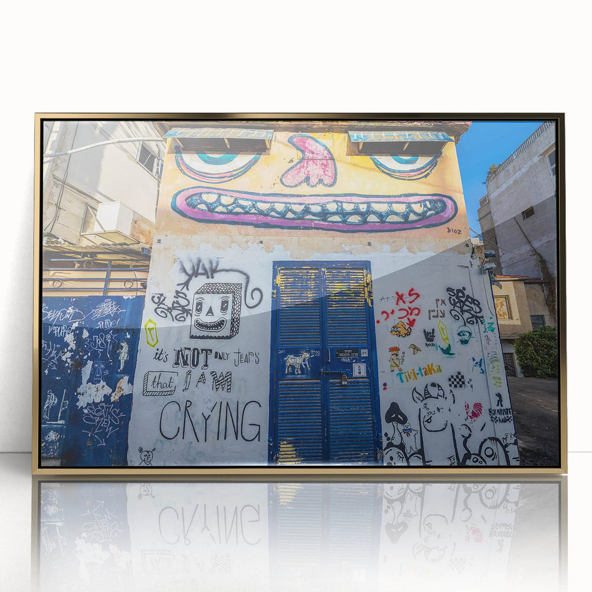 Large art print of Tel Aviv skyline in gold and blue tones on acrylic, styled in mid-century modernist.