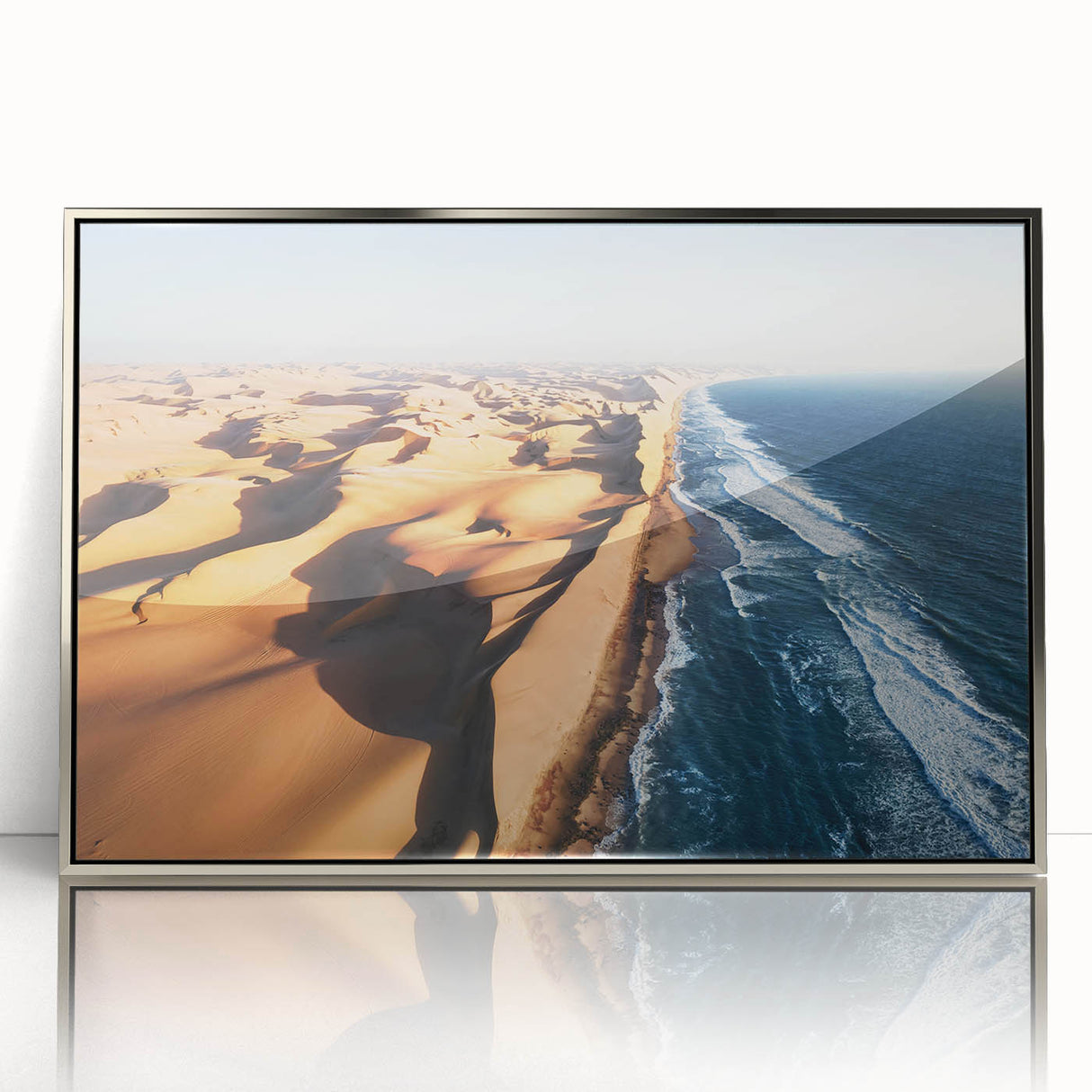 Acrylic print framed in silver featuring a serene Namibian landscape in soft earth tones, ideal for modern art wall decor.