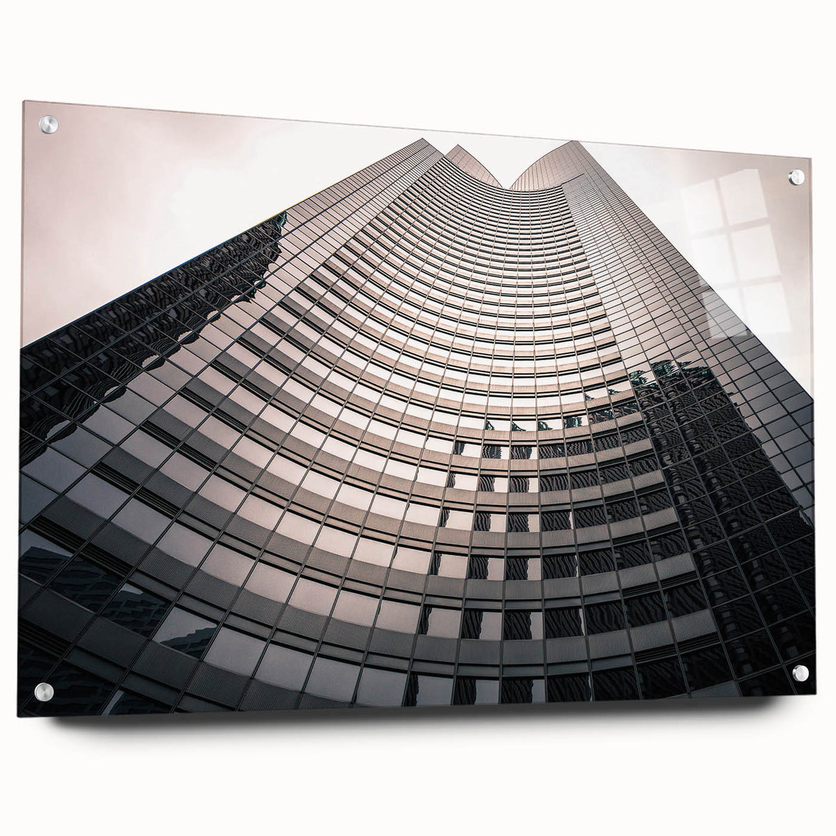 Acrylic glass print of a London cityscape featuring a detailed, large abstract design in muted colors.