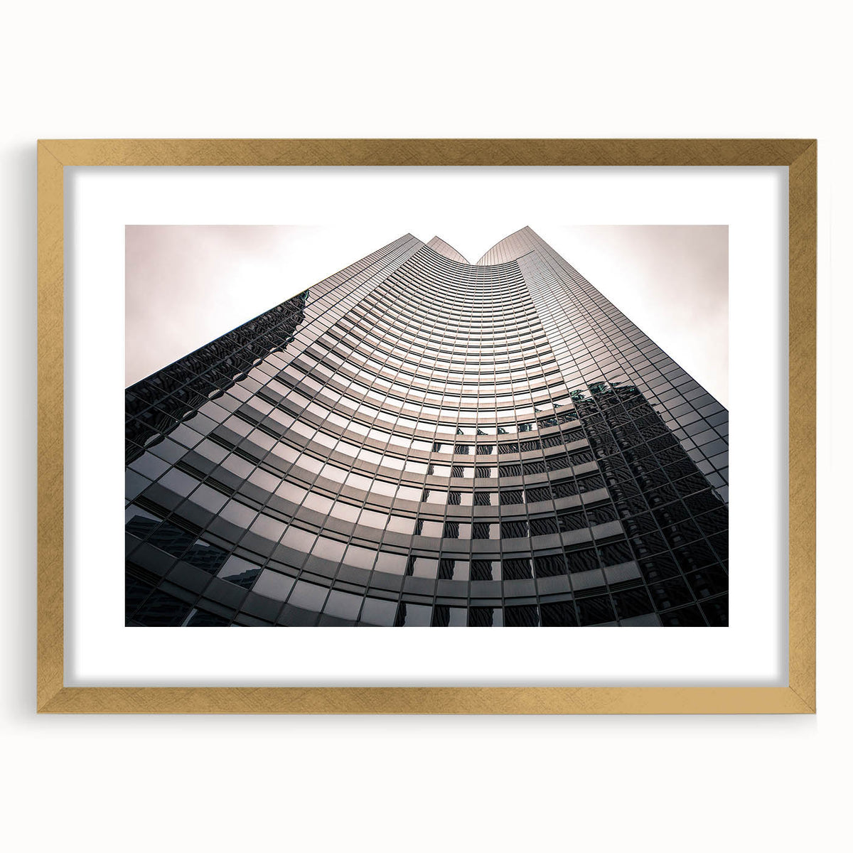 Abstract art print of London scenery in muted gold and blue tones, framed with a mat, suitable for dining room decor.