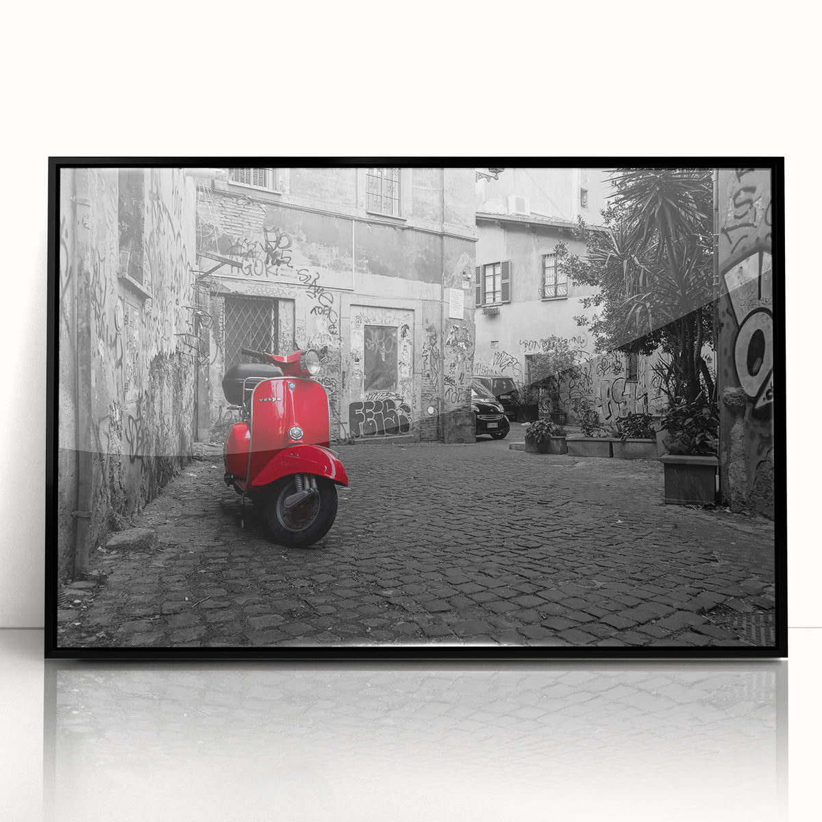 Large abstract wall art depicting a European cityscape in muted earth tones, framed in black acrylic.