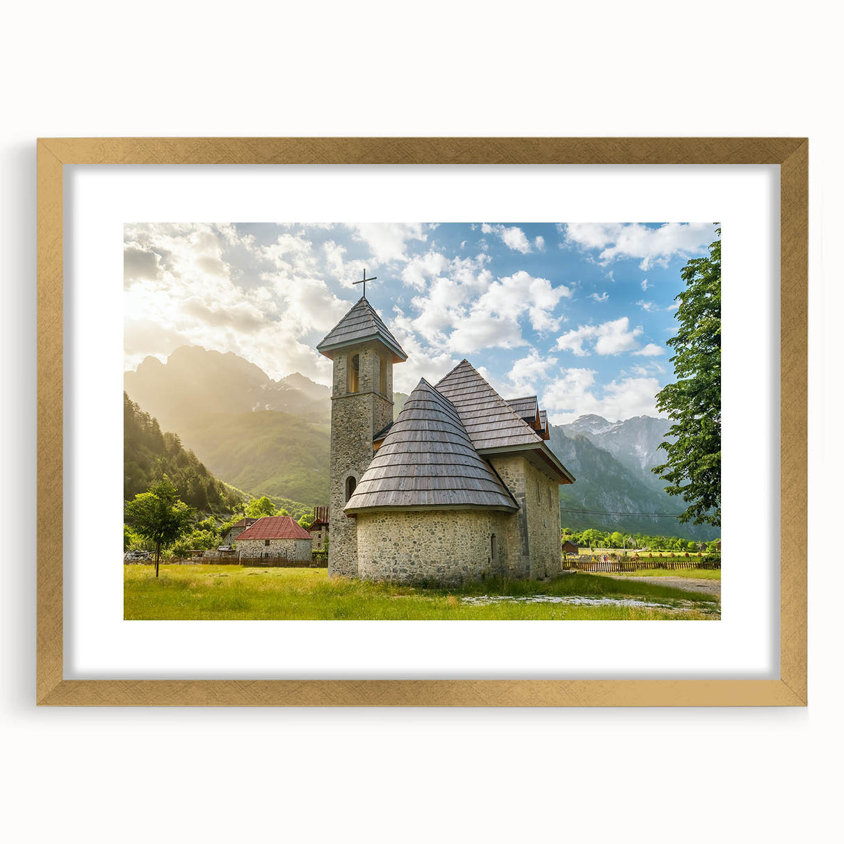 Abstract art print of a European Albanian scenery in muted earth tones, framed in gold.