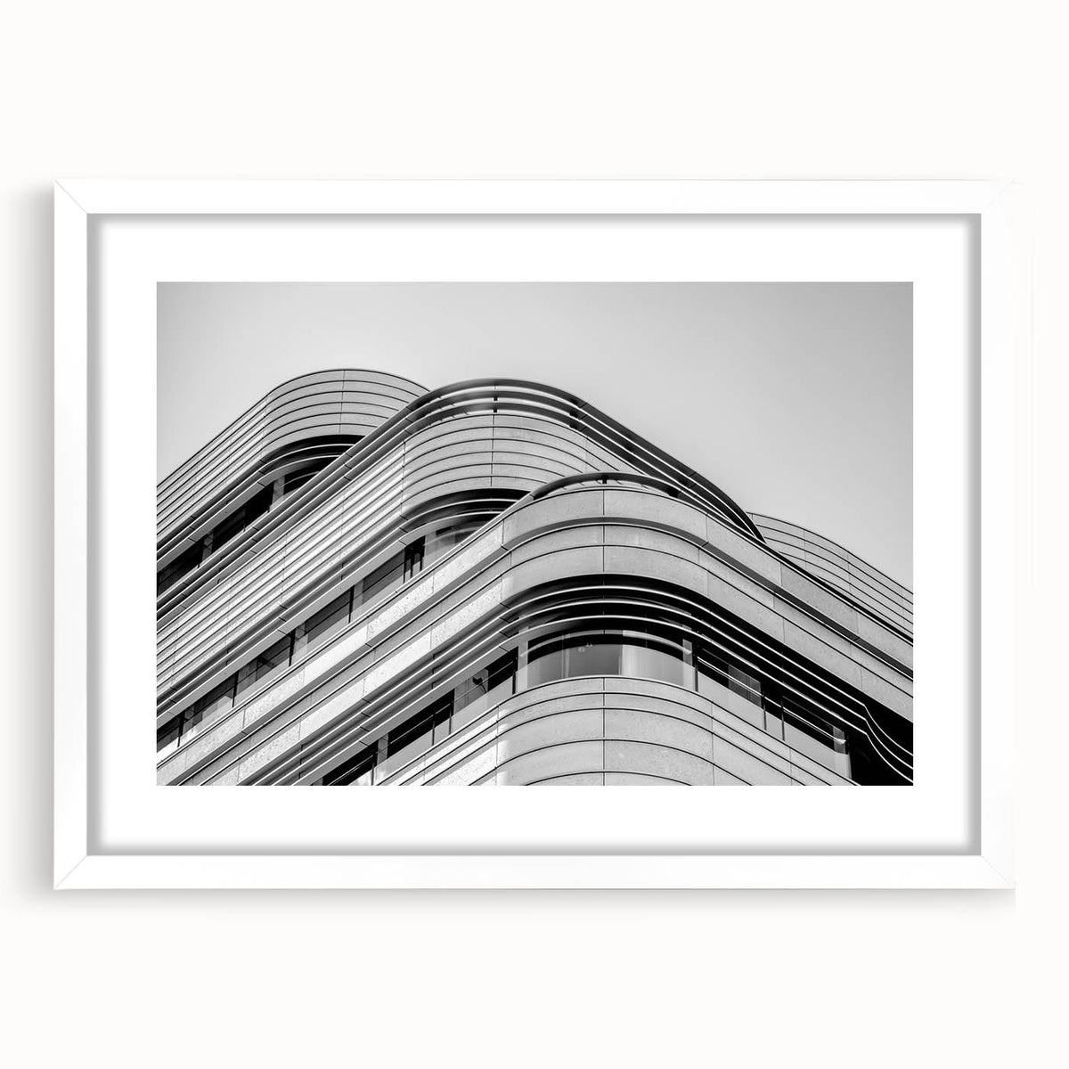 Textured abstract art print of London scenery in muted earth tones on a white framed mat, ideal for bedroom art.
