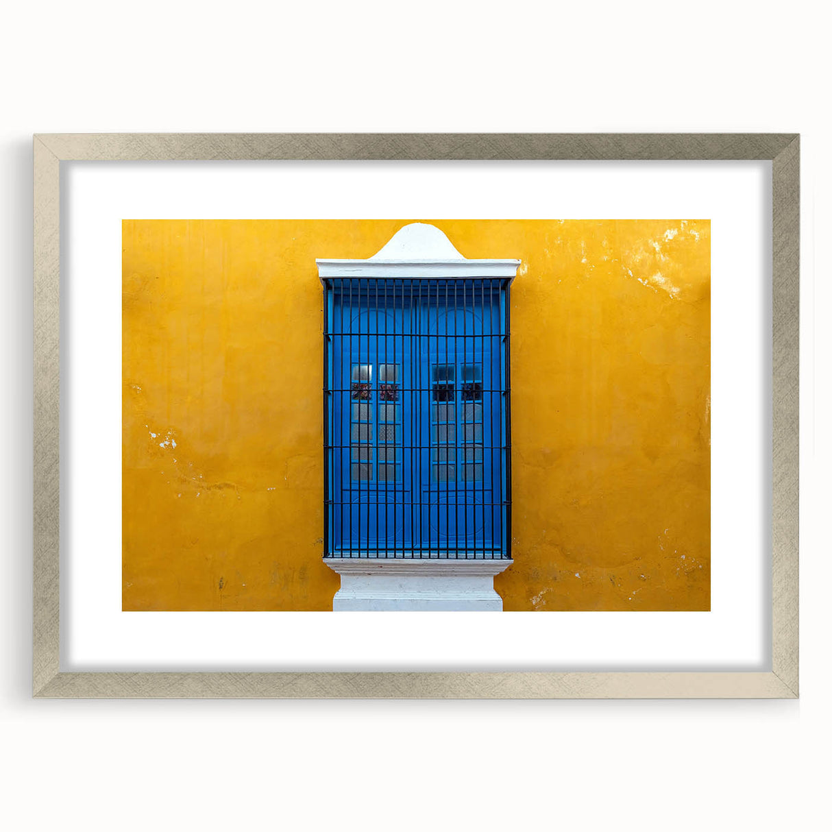 Textured abstract art print depicting a Yucatan scenery in muted earth tones, framed in silver, ideal for bedroom wall decor.