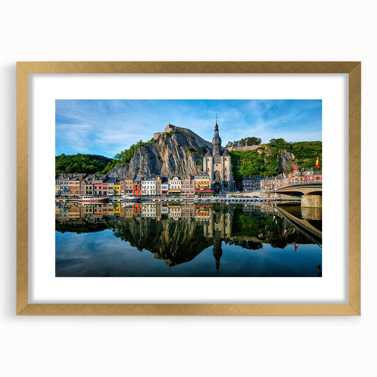 Abstract art print of a European scenery in muted gold and green tones, framed with a gold mat.