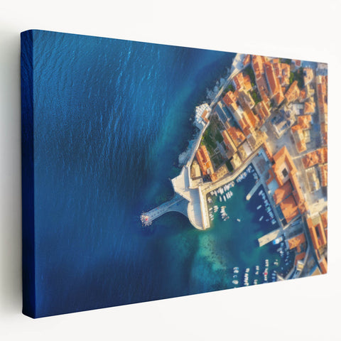 Large stretched canvas featuring a scenic European coastal town in soft pastel hues, ideal for kitchen wall art.