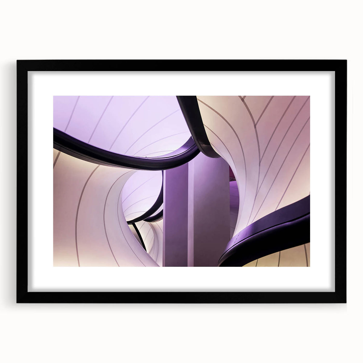 Colorful abstract art print of London scenery in vibrant hues on a large, textured canvas, framed in black.