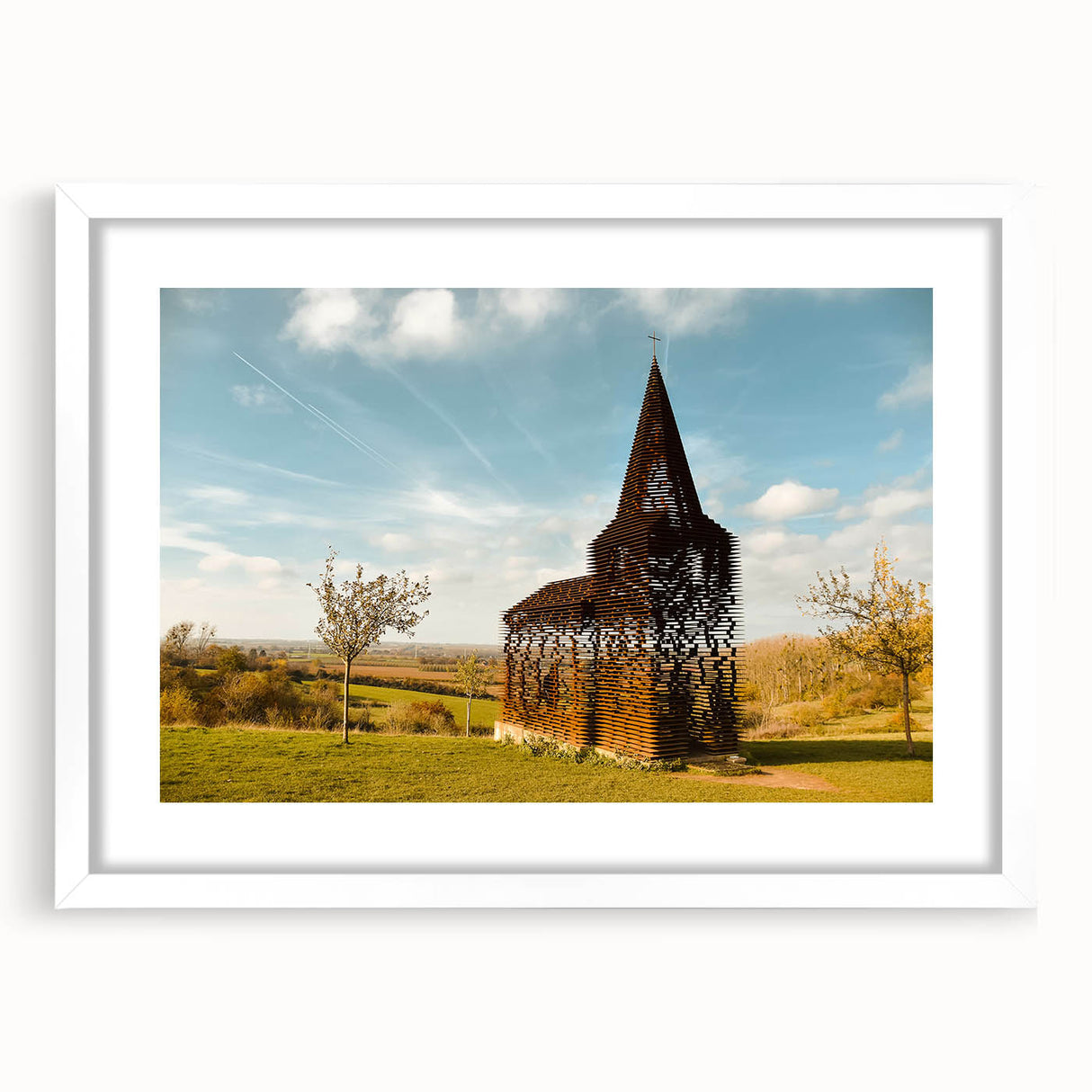 Textured abstract art print of European scenery in muted earth tones, framed with a white mat, ideal for bedroom art.