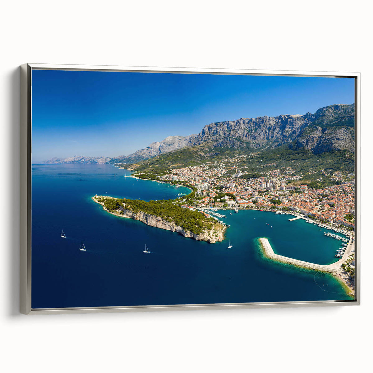 Framed canvas depicting a vintage-style Croatian landscape with colorful art and black borders, ideal for living room decor.