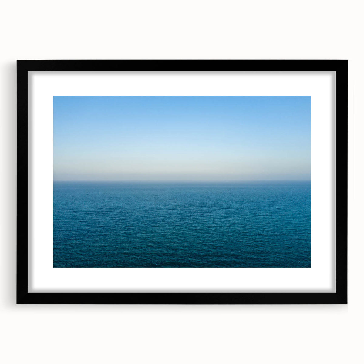 Extra large abstract art print of a vibrant, textured European scenery in a black frame, ideal for living room decor.