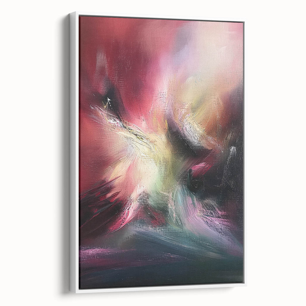 Framed abstract canvas art showcasing vibrant splatters on a white background, elegantly displayed from the side, perfect for modern home decor.