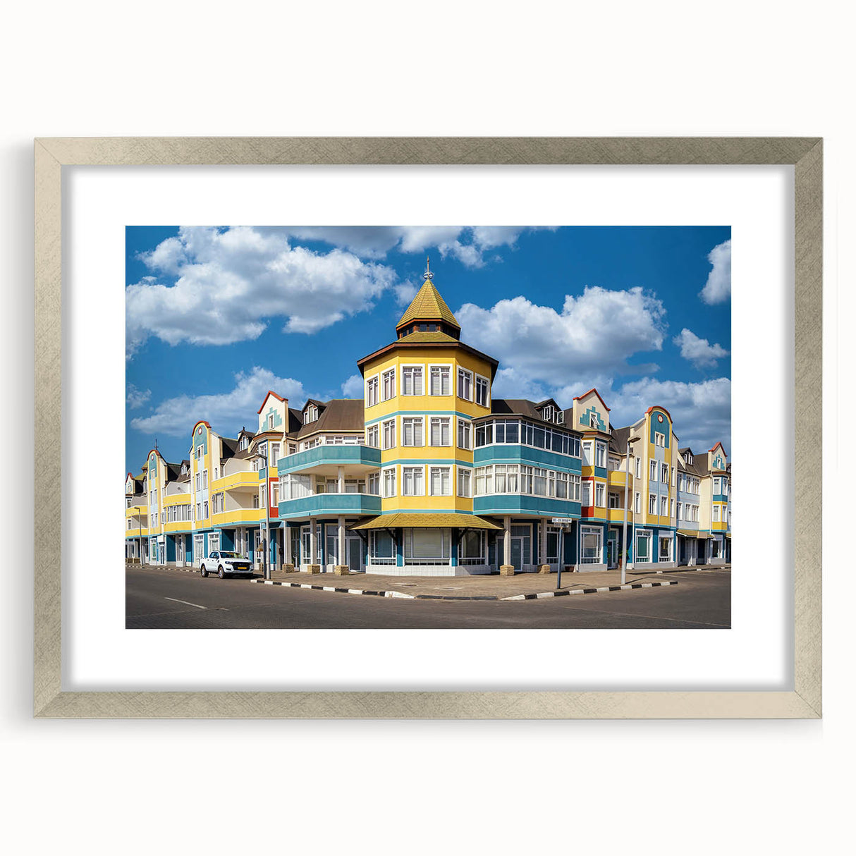 Abstract art print of Namibia scenery in muted earth tones on a framed canvas, suitable for dining room decor.