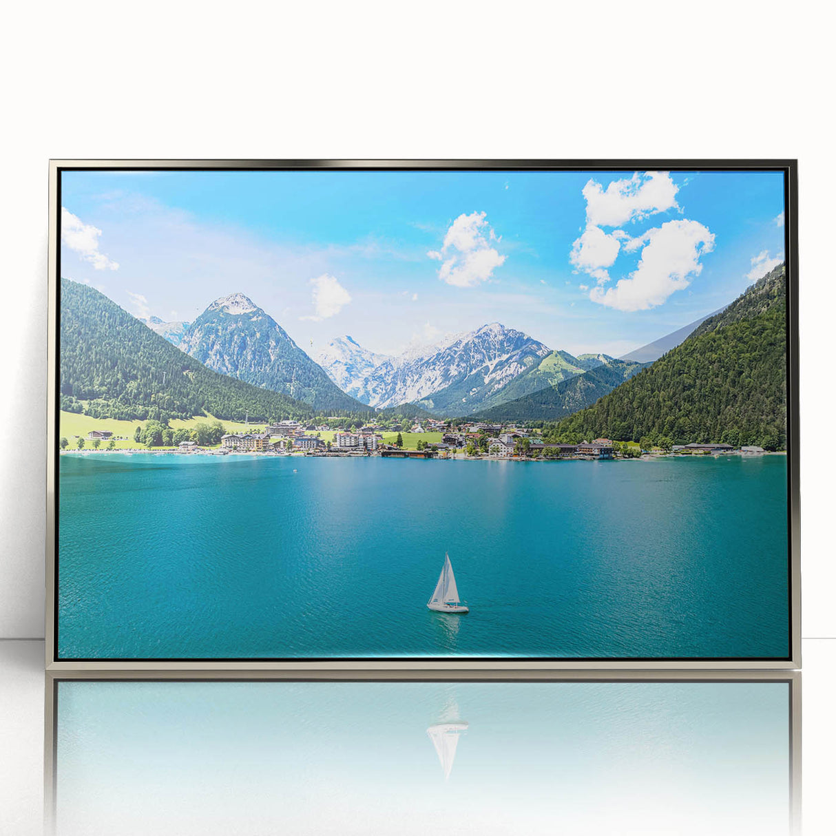 Large art print of a European Austrian landscape in muted greens and blues on a silver-framed acrylic.