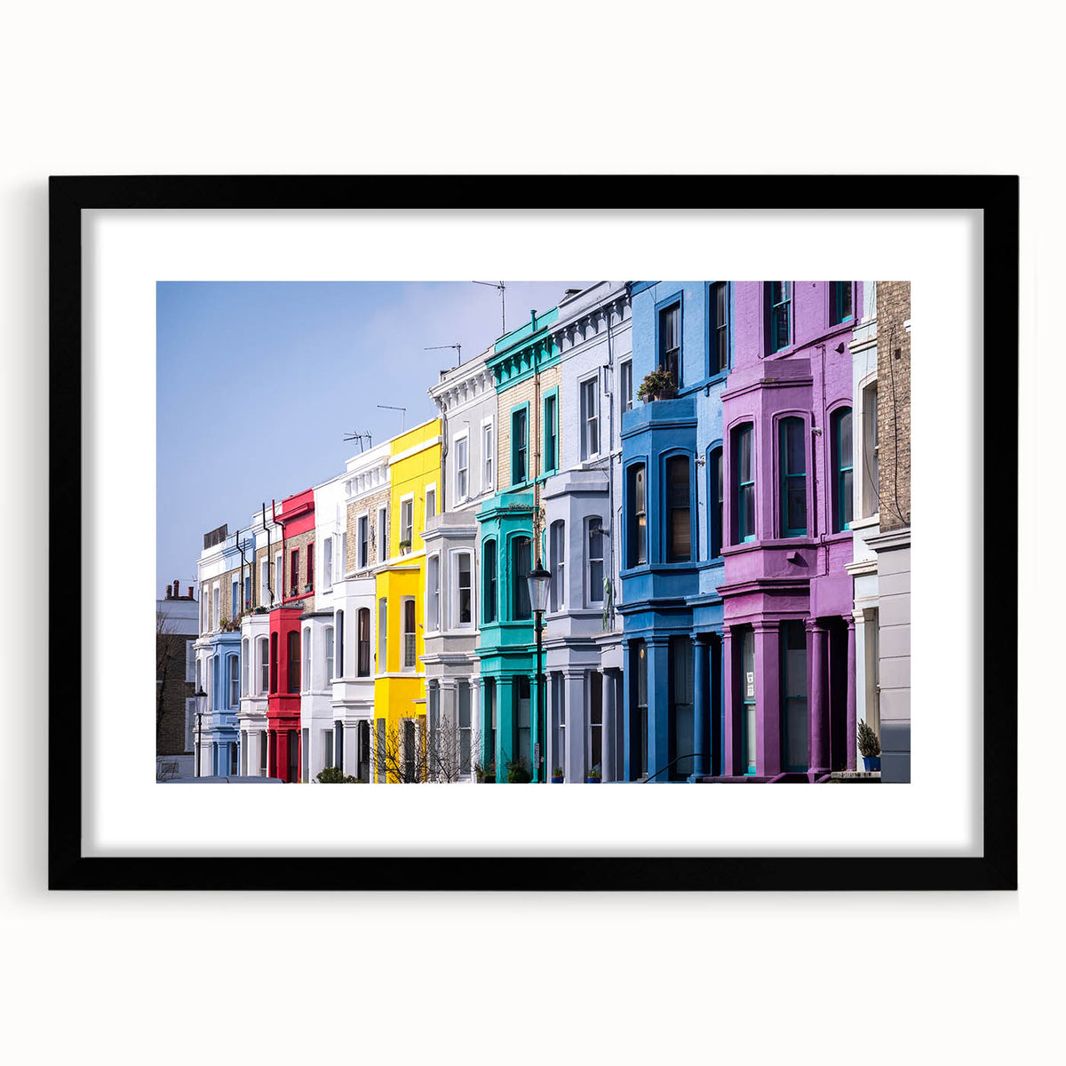 Abstract art print of a colorful London skyline, in a black frame with a mat, ideal for living room decor.