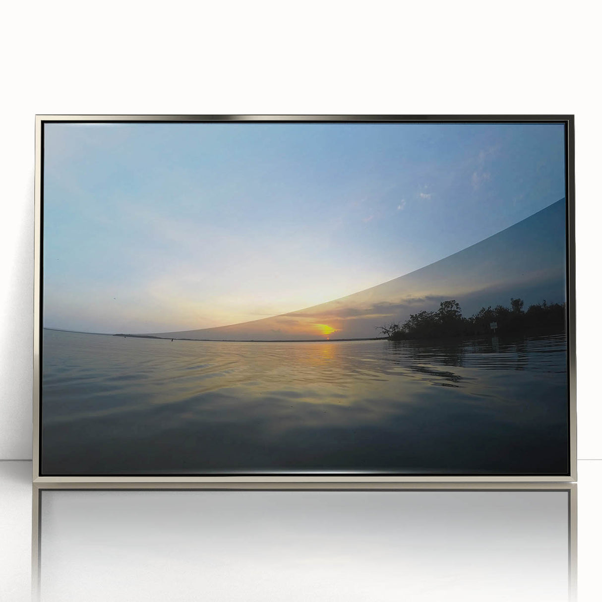 Mid-century modernist art depicting a Yucatan scenery in muted earth tones on a silver-framed acrylic.