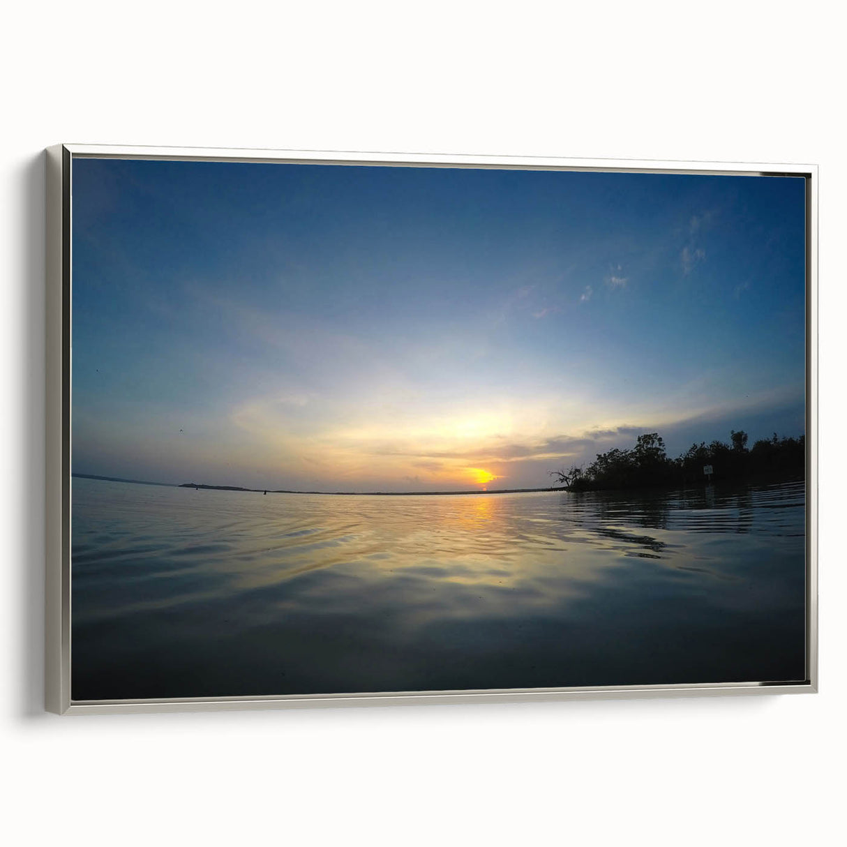 Framed canvas of a vintage-style landscape painting featuring the Yucatan scenery in silver, black, and colorful tones.