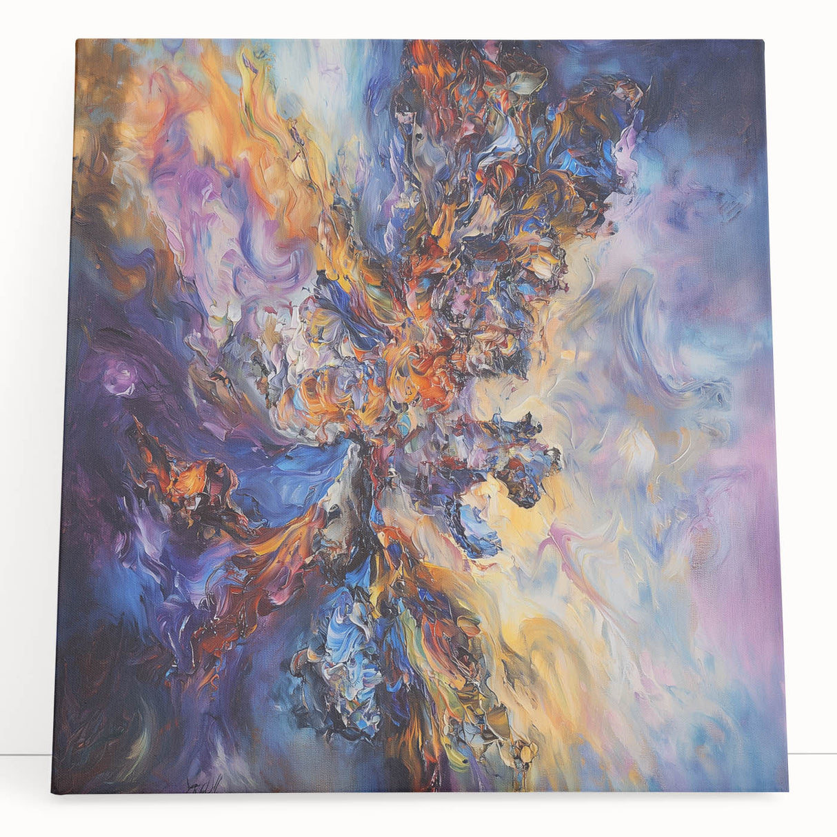 Abstract splatter art canvas featuring vibrant colors in a dynamic design, leaning against a textured wall, ideal for modern home decor and artistic spaces.