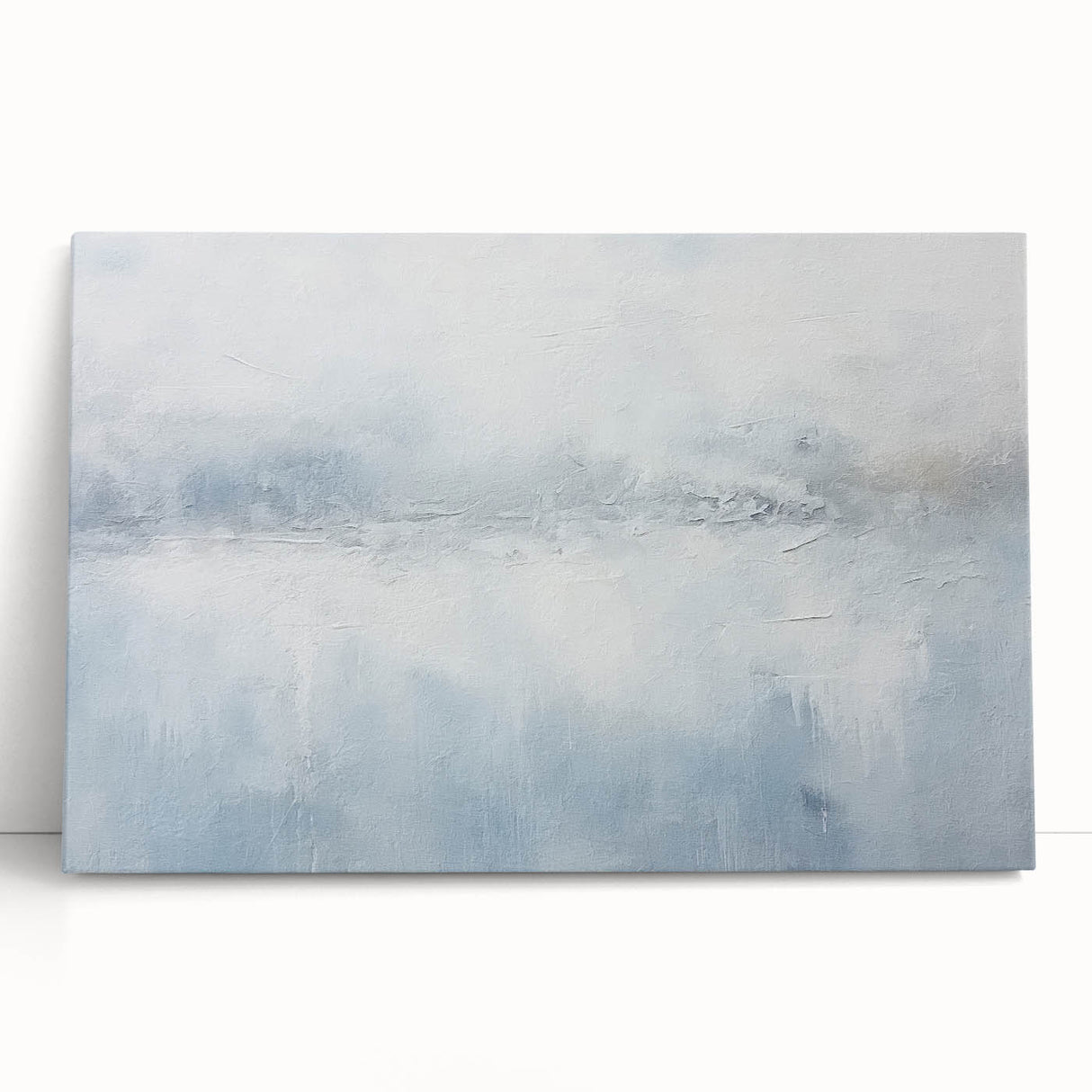 Abstract wall art featuring vibrant blue, orange, and yellow strokes on stretched canvas, leaning against a neutral wall, perfect for modern home decor.