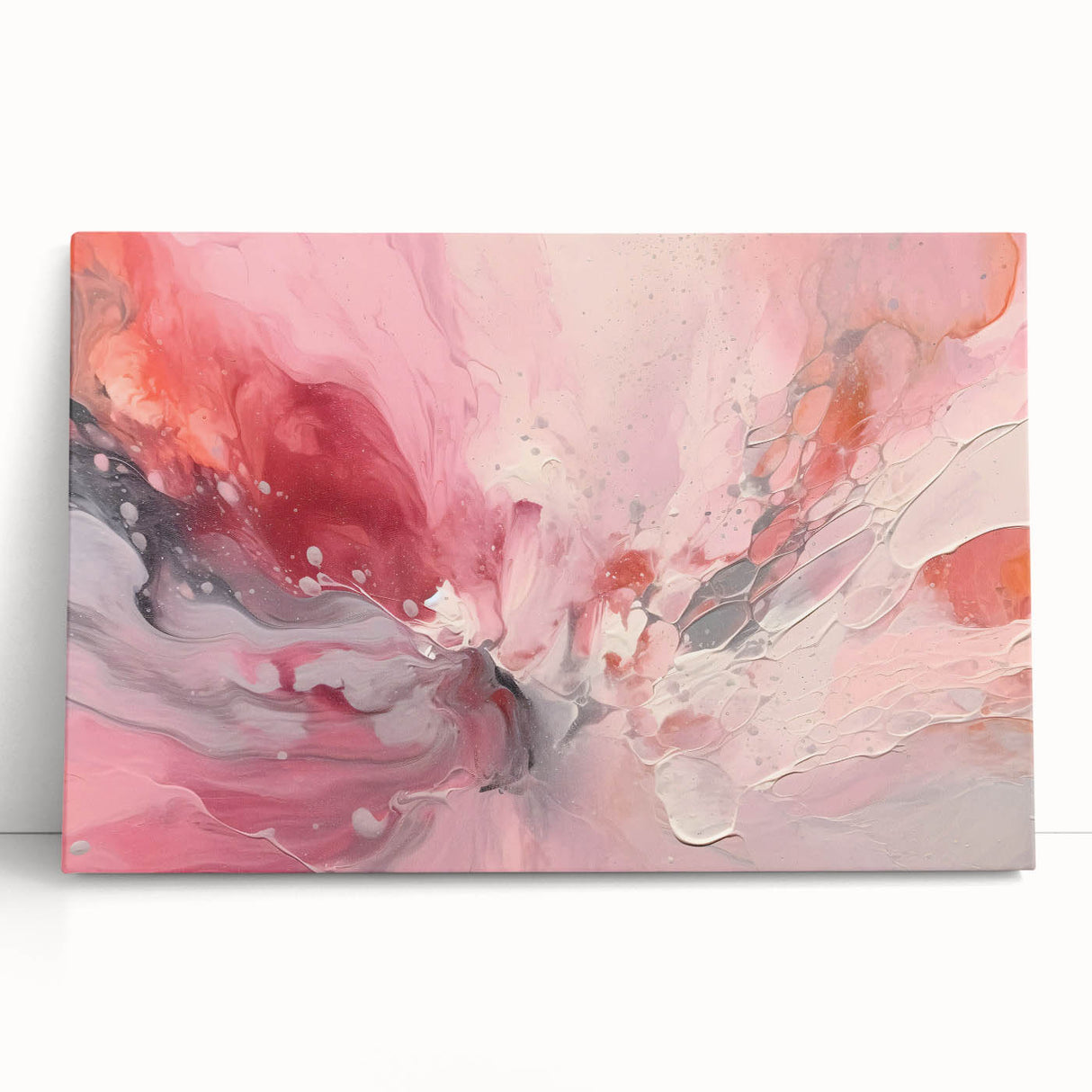 Abstract wall art featuring vibrant strokes of blue, pink, and gold on a stretched canvas, elegantly leaning against a neutral wall, ideal for modern home decor.