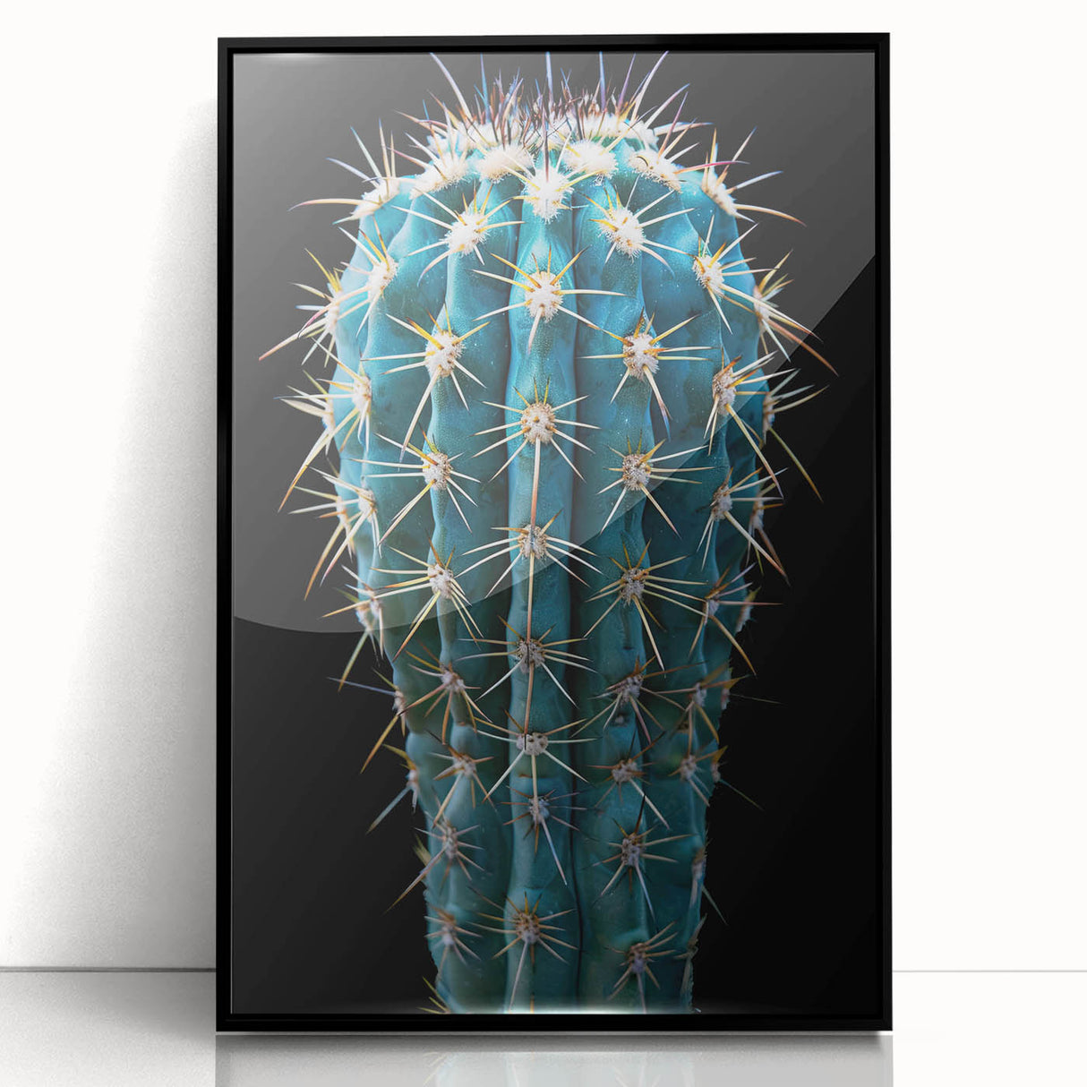 Framed wall art featuring a botanical cactus design with vibrant colors, set in a sleek black frame, ideal for modern home decor and nature enthusiasts.
