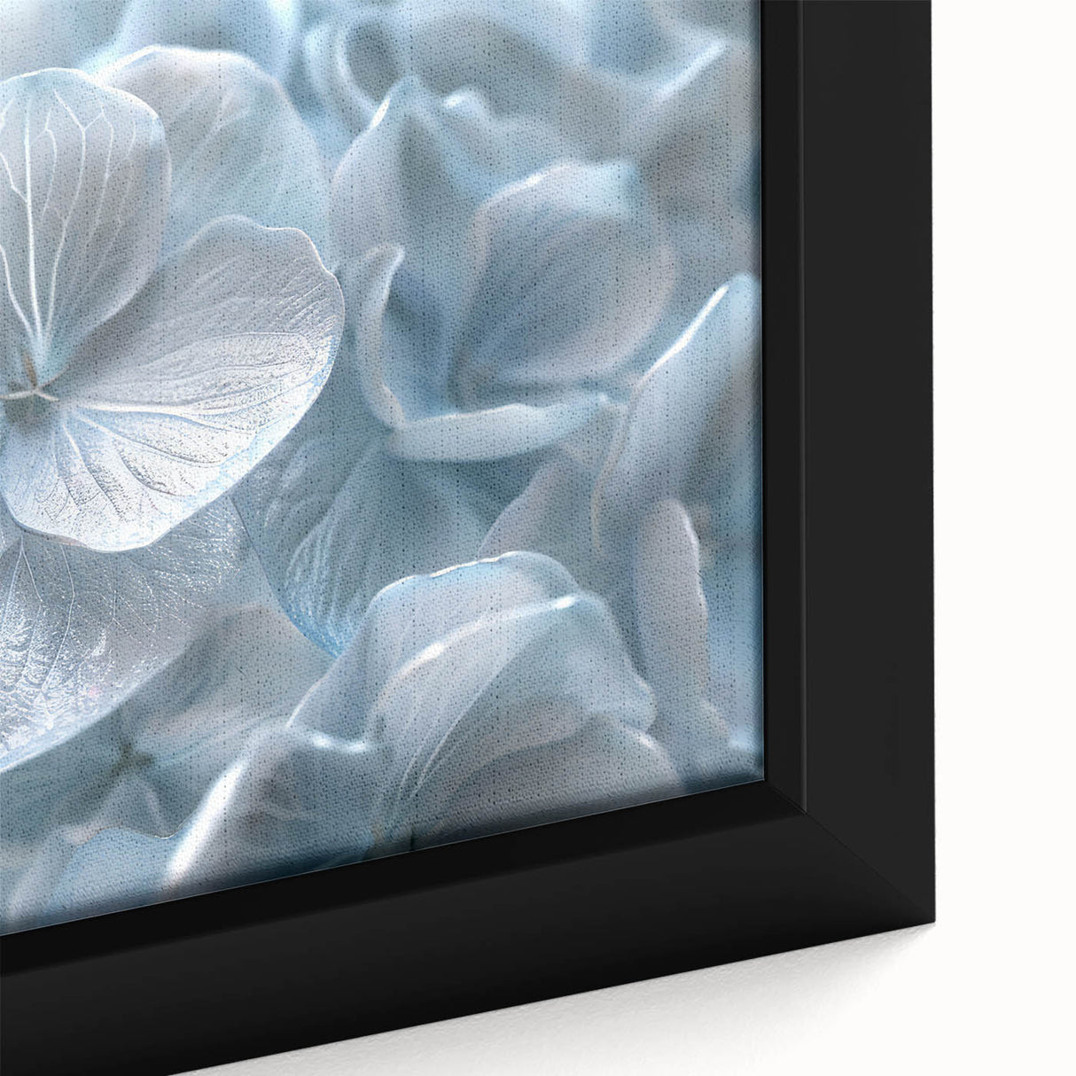 Close-up of a framed botanical wall art piece showcasing vibrant blue and purple hydrangeas on a textured canvas, perfect for home decor and floral enthusiasts.