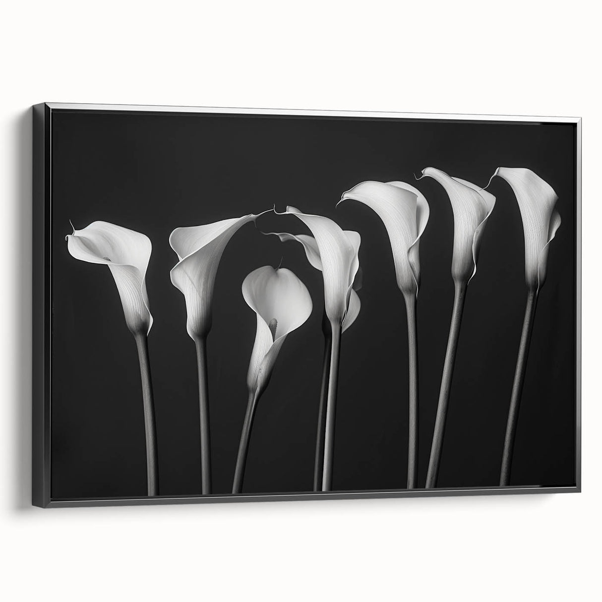 Framed botanical wall art featuring a delicate lily design on a black background, showcasing elegant details and a sleek side view, perfect for home decor.