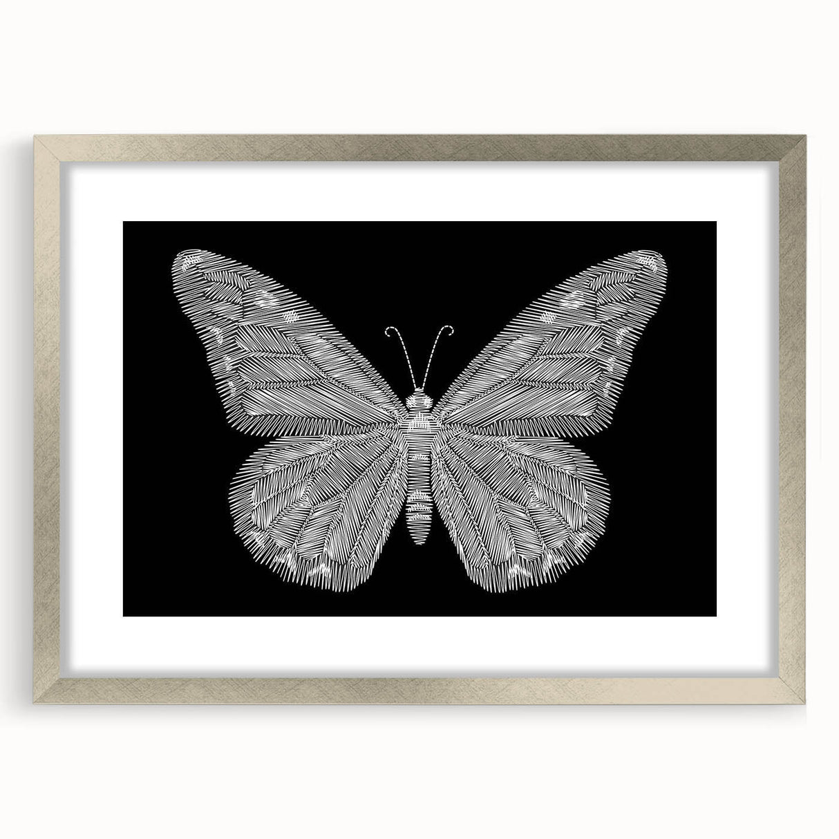 Decorative wall art featuring a butterfly and arachnid design in a silver frame with a mat, ideal for adding a touch of nature-inspired elegance to home decor.