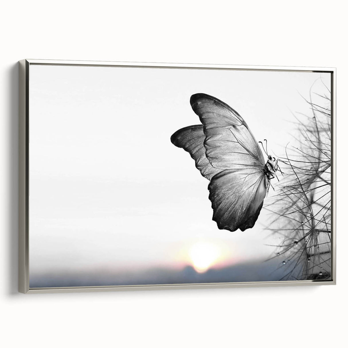 Framed wall art featuring a colorful butterfly design with intricate details on a canvas, presented from a silver side view to showcase its elegant profile and artistic flair.